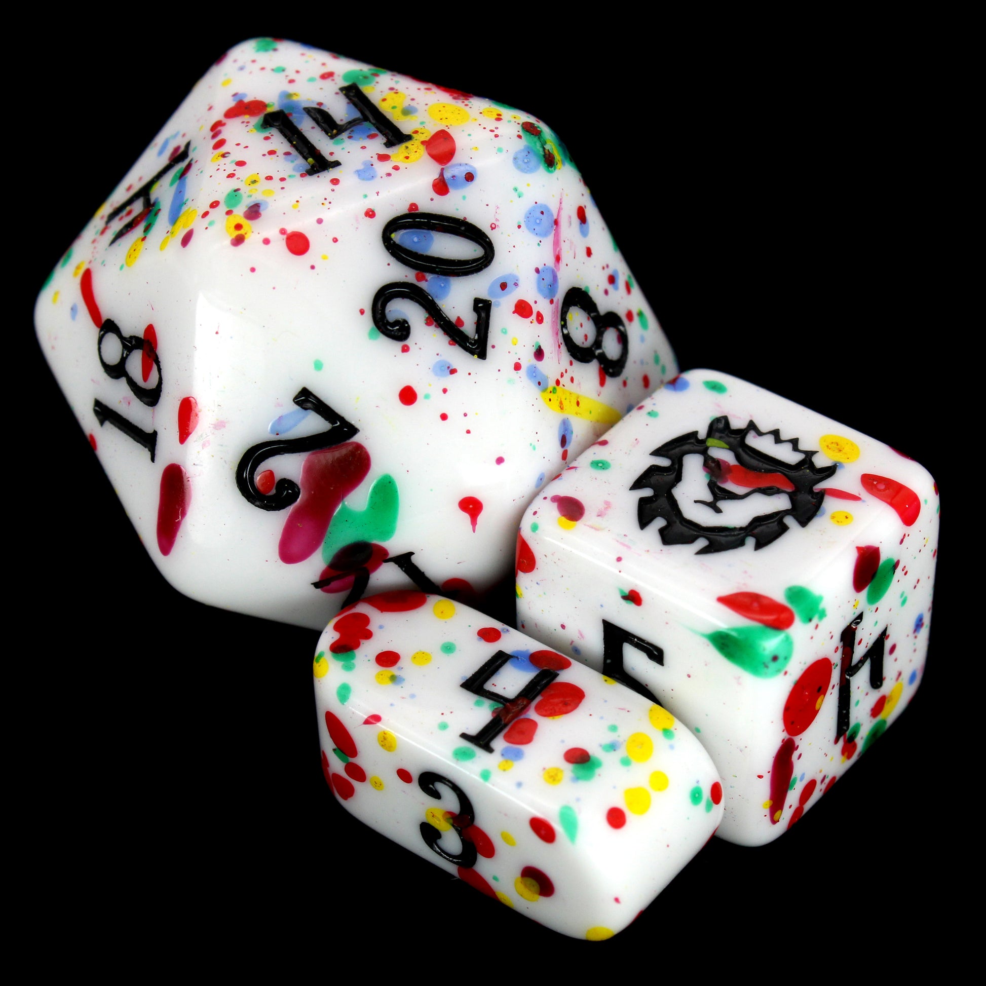 Gobbostopper is a 10-piece white acrylic set with black ink and red, blue, yellow, and green splatters. Please do not eat the dice, goblin or not!