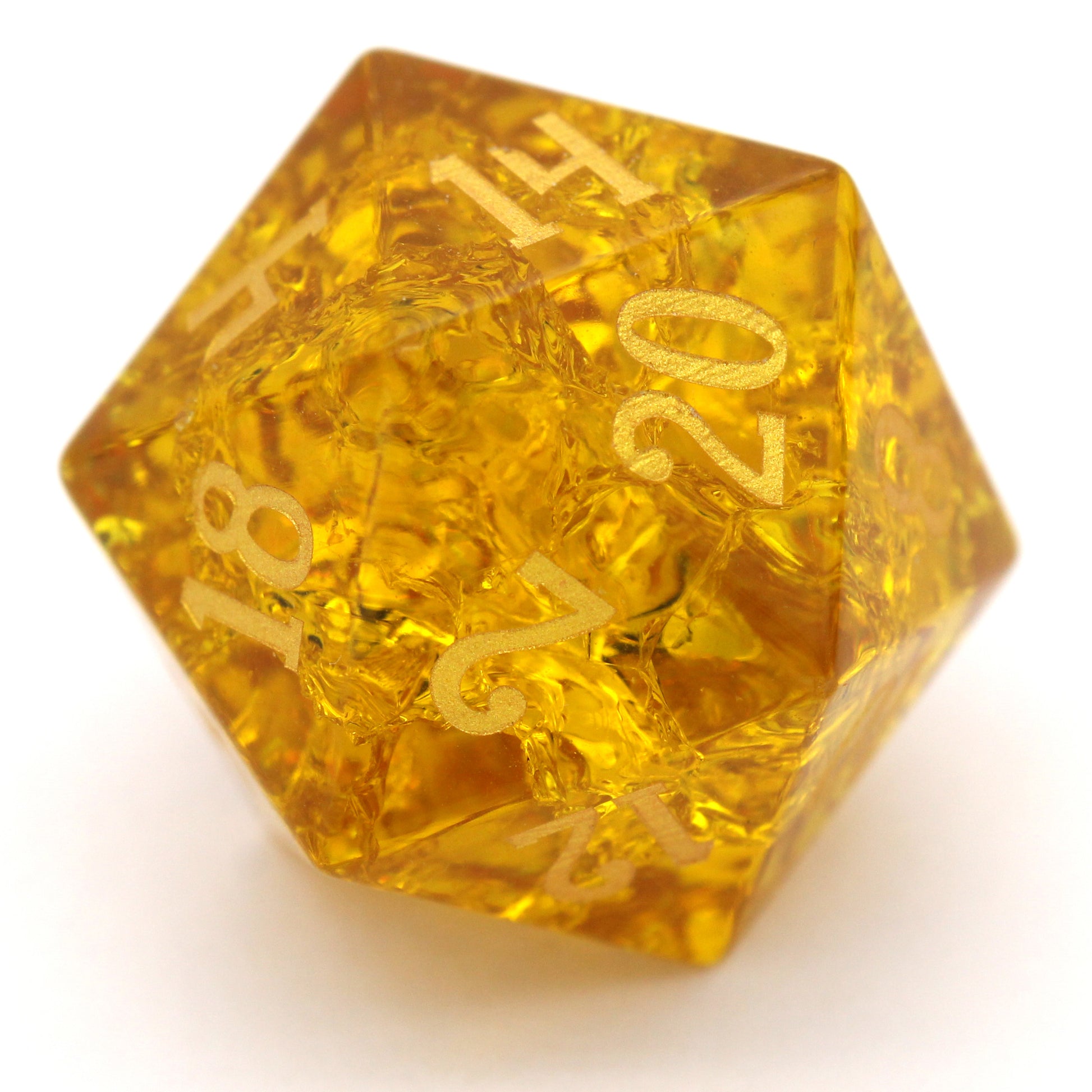 Golden Hour is a 7-piece set of amber crystal dice with a crackle effect and gold numbering.