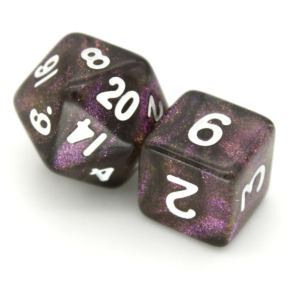 Grapeful Dead is a 7-piece, 13mm, black resin dice set shimmering with violet glitter and inked in white.