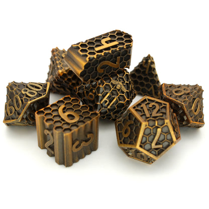 Hive Mind is an 8-piece Dice Envy exclusive set of honeycomb patterned dice in aged gold. This set includes an Infinity d4!