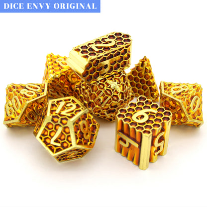 Honeycomb is an 8-piece Dice Envy Original set of honeycomb patterned dice, plated in bright gold and filled with amber enamel.
