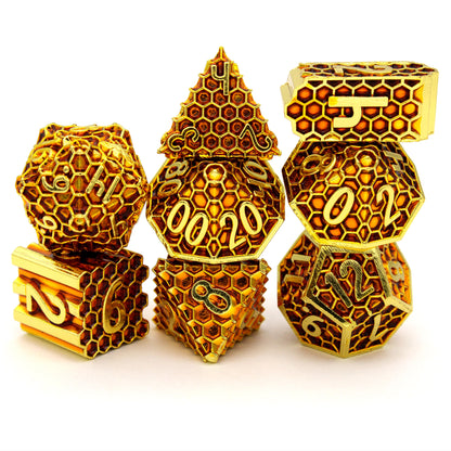 Honeycomb is an 8-piece Dice Envy Original set of honeycomb patterned dice, plated in bright gold and filled with amber enamel.