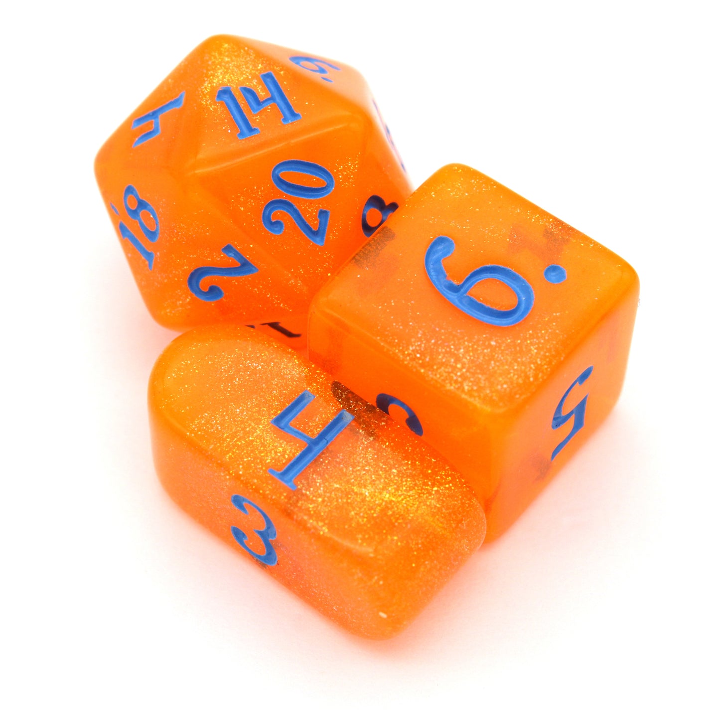 In Queso Emergency is a 10-piece semi-transparent orange resin set filled with micro glitter, and inked in bright blue.