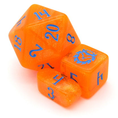 In Queso Emergency is a 10-piece semi-transparent orange resin set filled with micro glitter, and inked in bright blue.
