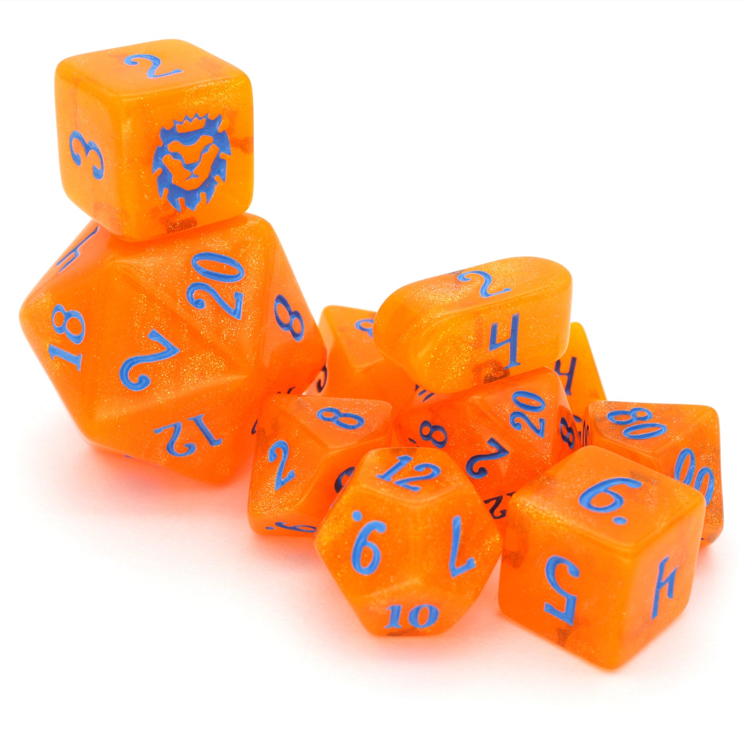 In Queso Emergency is a 10-piece semi-transparent orange resin set filled with micro glitter, and inked in bright blue.