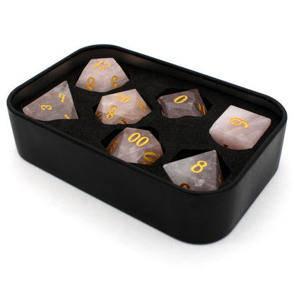 La Vie En Rose is a 7-piece set of rose quartz dice with gold numbering.