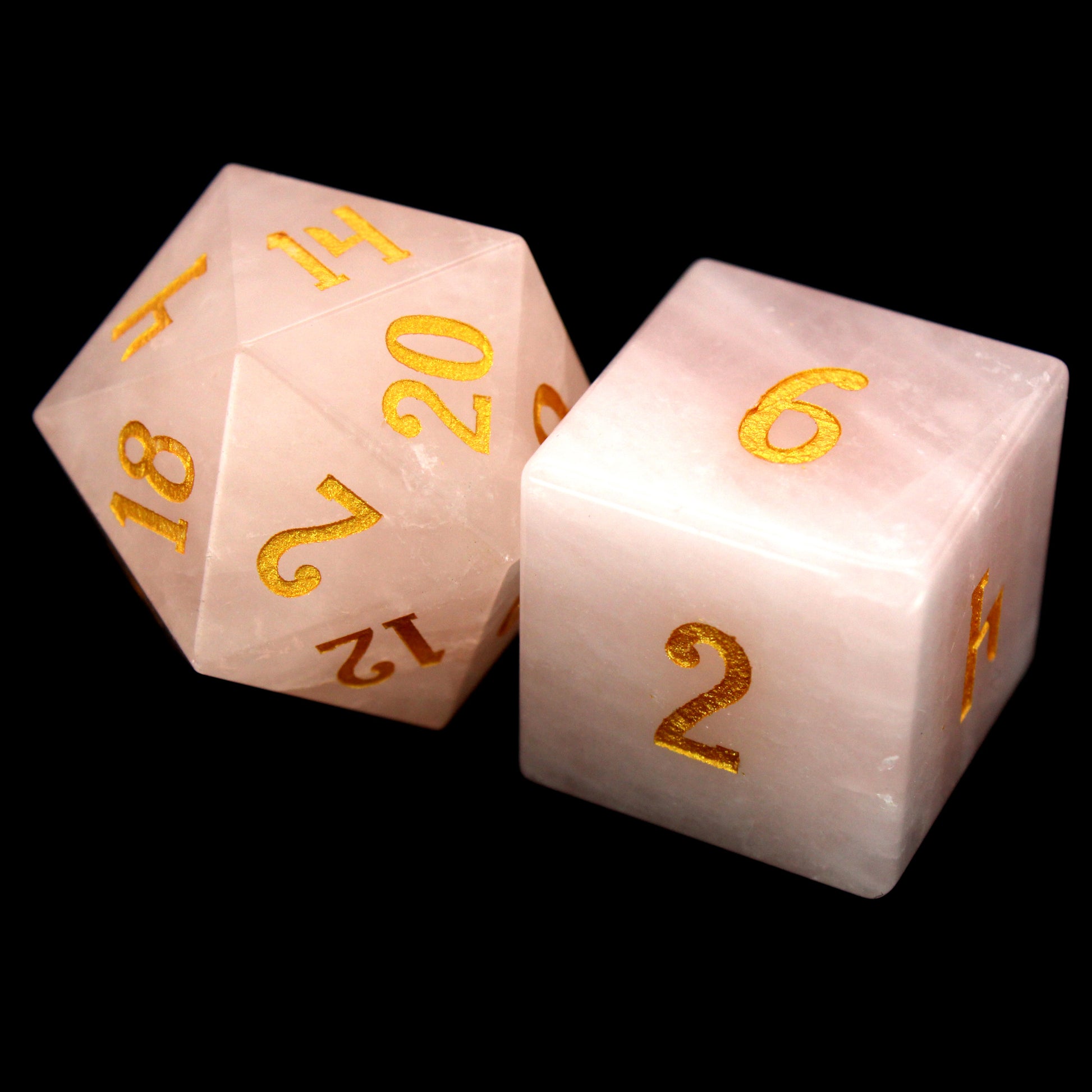 La Vie En Rose is a 7-piece set of rose quartz dice with gold numbering.