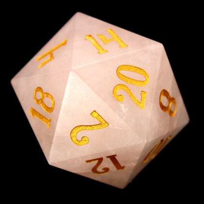 La Vie En Rose is a 7-piece set of rose quartz dice with gold numbering.