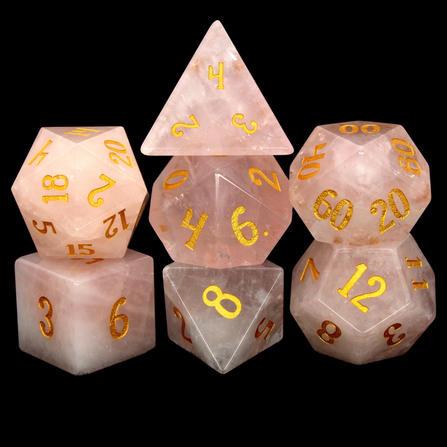 La Vie En Rose is a 7-piece set of rose quartz dice with gold numbering.
