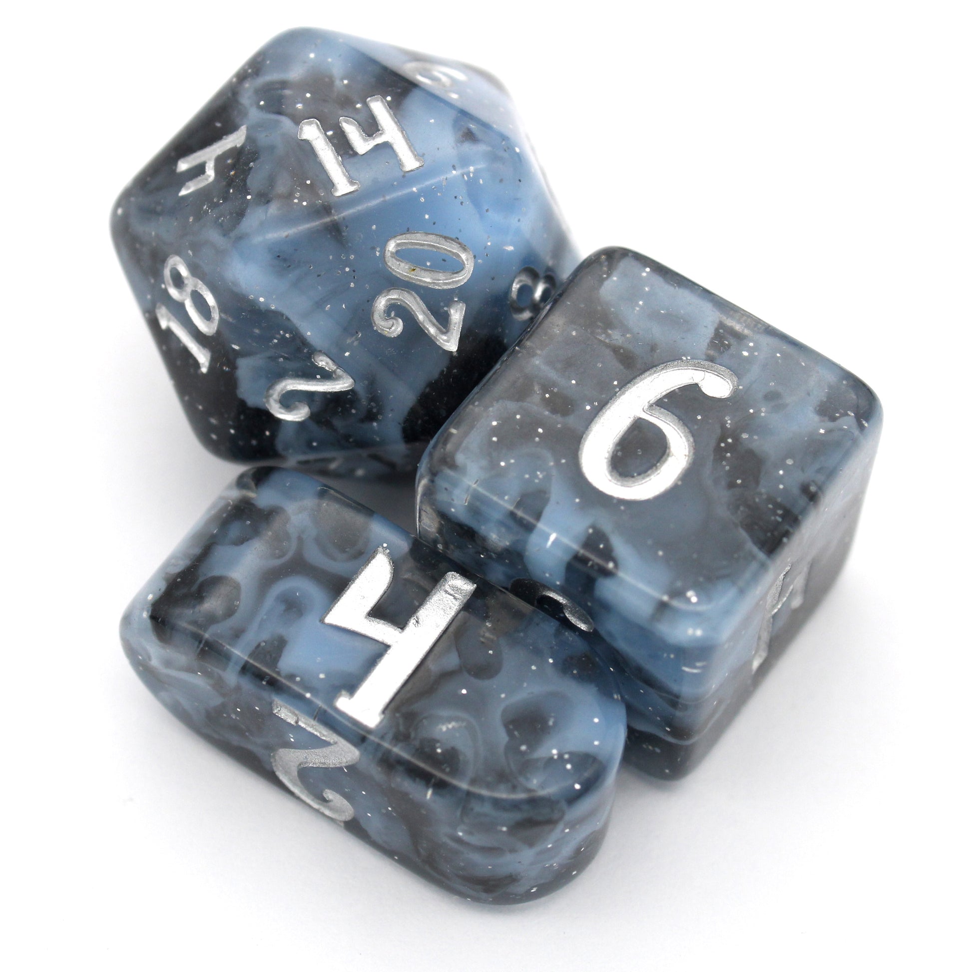 Lagoon is a 10-piece resin set featuring billowing clouds of light blue and glittery translucent black, inked in luminous silver.