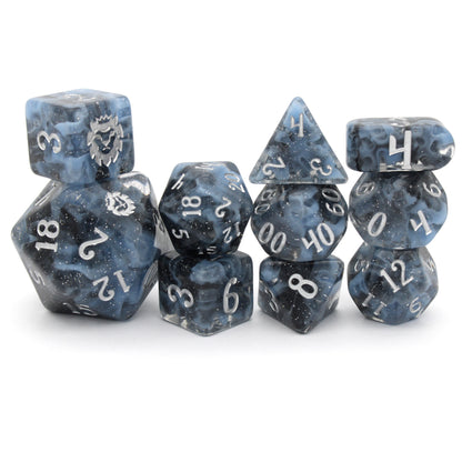 Lagoon is a 10-piece resin set featuring billowing clouds of light blue and glittery translucent black, inked in luminous silver.