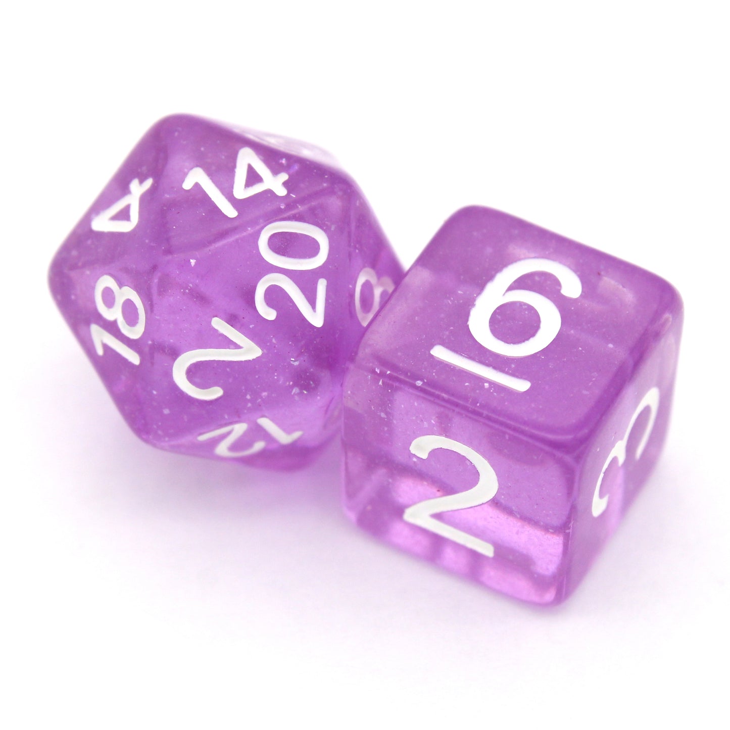 Lilactivity is a 7-piece, 13mm polymer set of transparent purple resin dice, shimmering with silvery glitter and inked in bright white. It belongs to our tiny but mighty Wee Lads collection. Standard d20 pictured for scale.