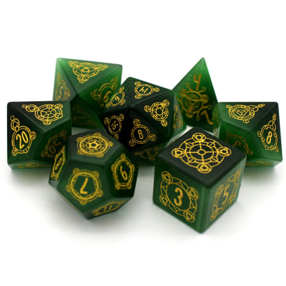 Luckstone is a 7-piece set cut from green lab-made chatoyant stone, engraved with Dice Envy's exclusive Sigil design and inked in gold.