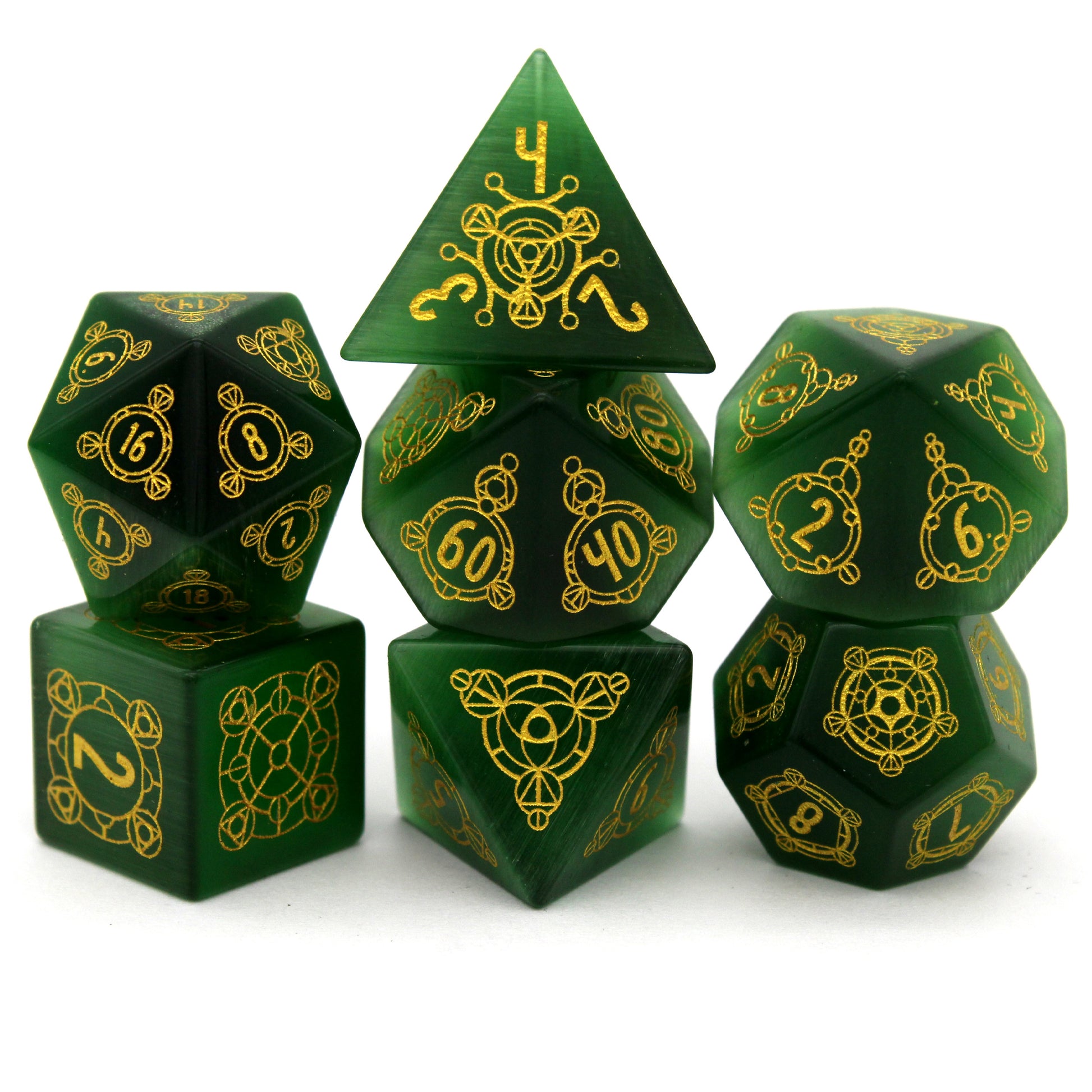 Luckstone is a 7-piece set cut from green lab-made chatoyant stone, engraved with Dice Envy's exclusive Sigil design and inked in gold.