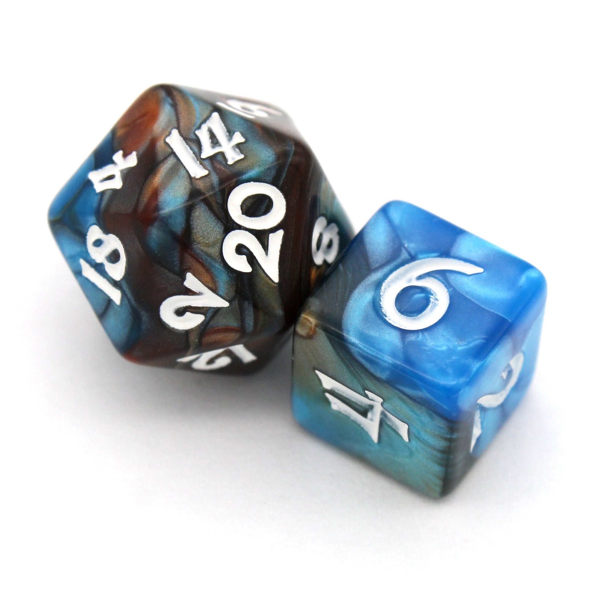 Magewrights is a 7-piece, 13mm polymer set of swirled blue and orange acrylic dice, inked in white. It belongs to our tiny but mighty Wee Lads collection. Standard d20 pictured for scale.