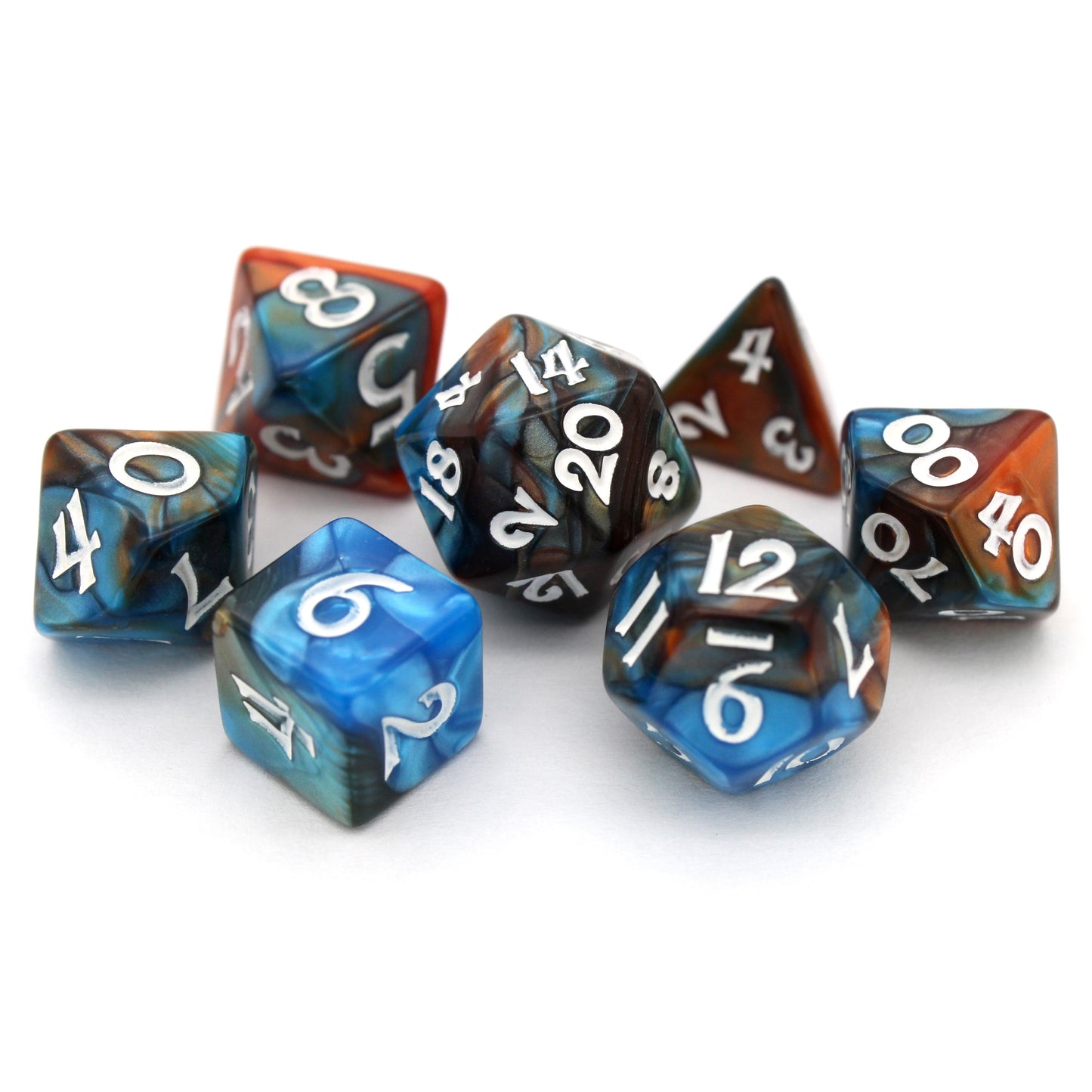 Magewrights is a 7-piece, 13mm polymer set of swirled blue and orange acrylic dice, inked in white. It belongs to our tiny but mighty Wee Lads collection. Standard d20 pictured for scale.