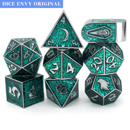 Maleficent is an 8-piece Dice Envy Original set of silver metal dice in our Raven Queen mold, cloaked in evil green enamel.