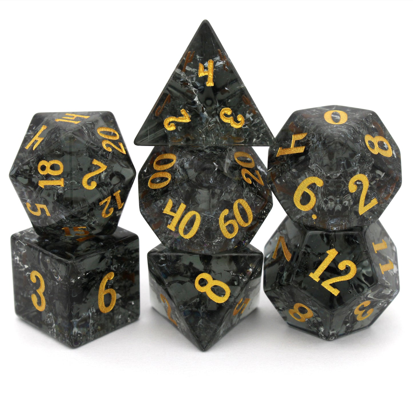 Midnight Sparkle is a 7-piece set of navy gray crystal dice with a crackle effect and gold numbering.