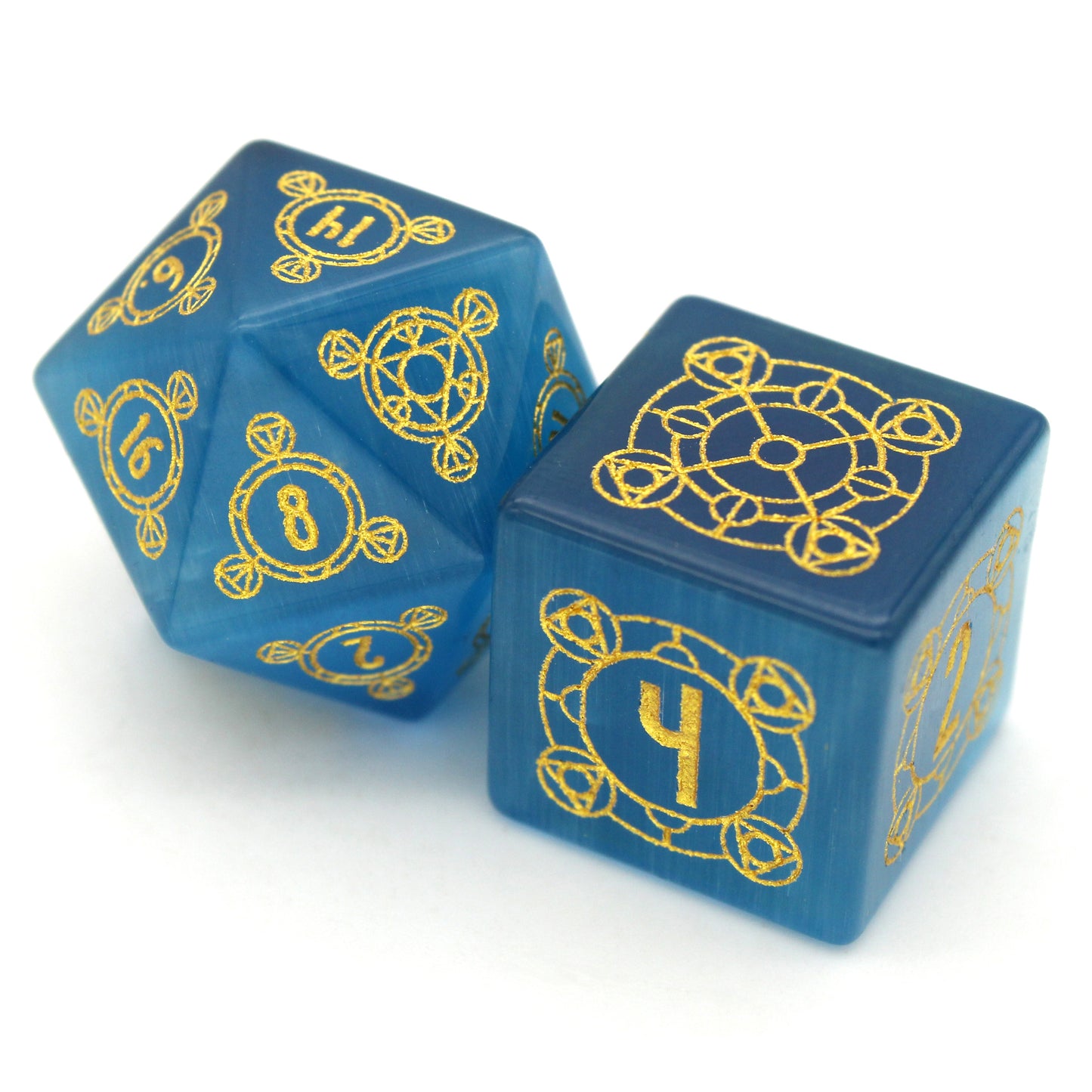 Midsummer's Eve is a 7-piece set of dice cut from blue, lab-made chatoyant stone, engraved with Dice Envy's exclusive Sigil design and inked in gold.