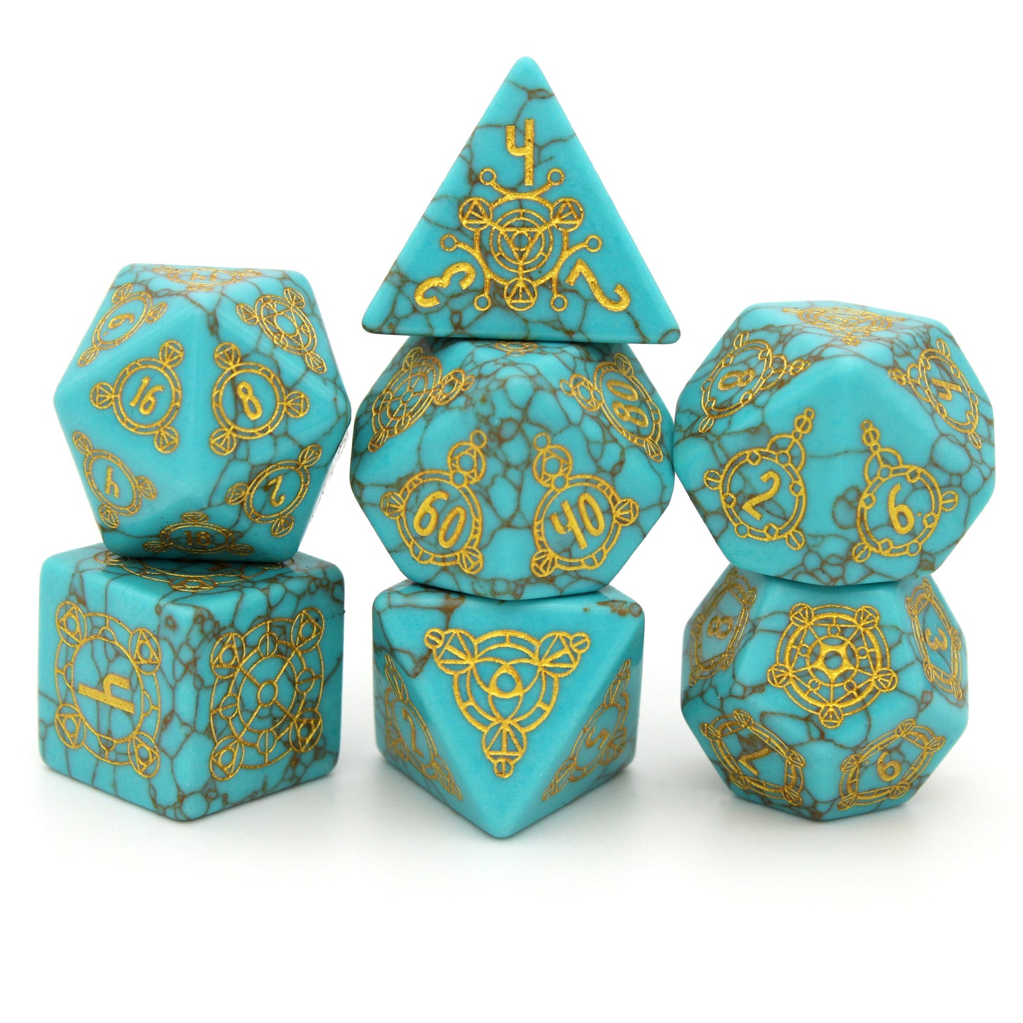 Oasis is a 7-piece set of dice cut from lab-made turquoise, engraved with Dice Envy's exclusive Sigil design and inked in gold.