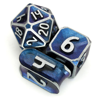 Oath of Devotion is a Dice Envy Exclusive 8-piece set of zinc-alloy, concave, metal dice with a metallic blue paint glaze. It is part of the Oathbound collection.