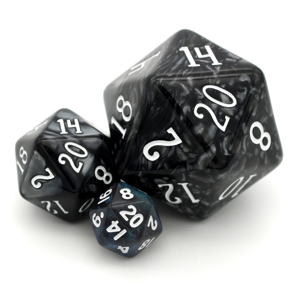 Occult Oceans is a 7-piece, 13mm, dark grey resin dice set featuring teal blue micro glitter, inked in white.