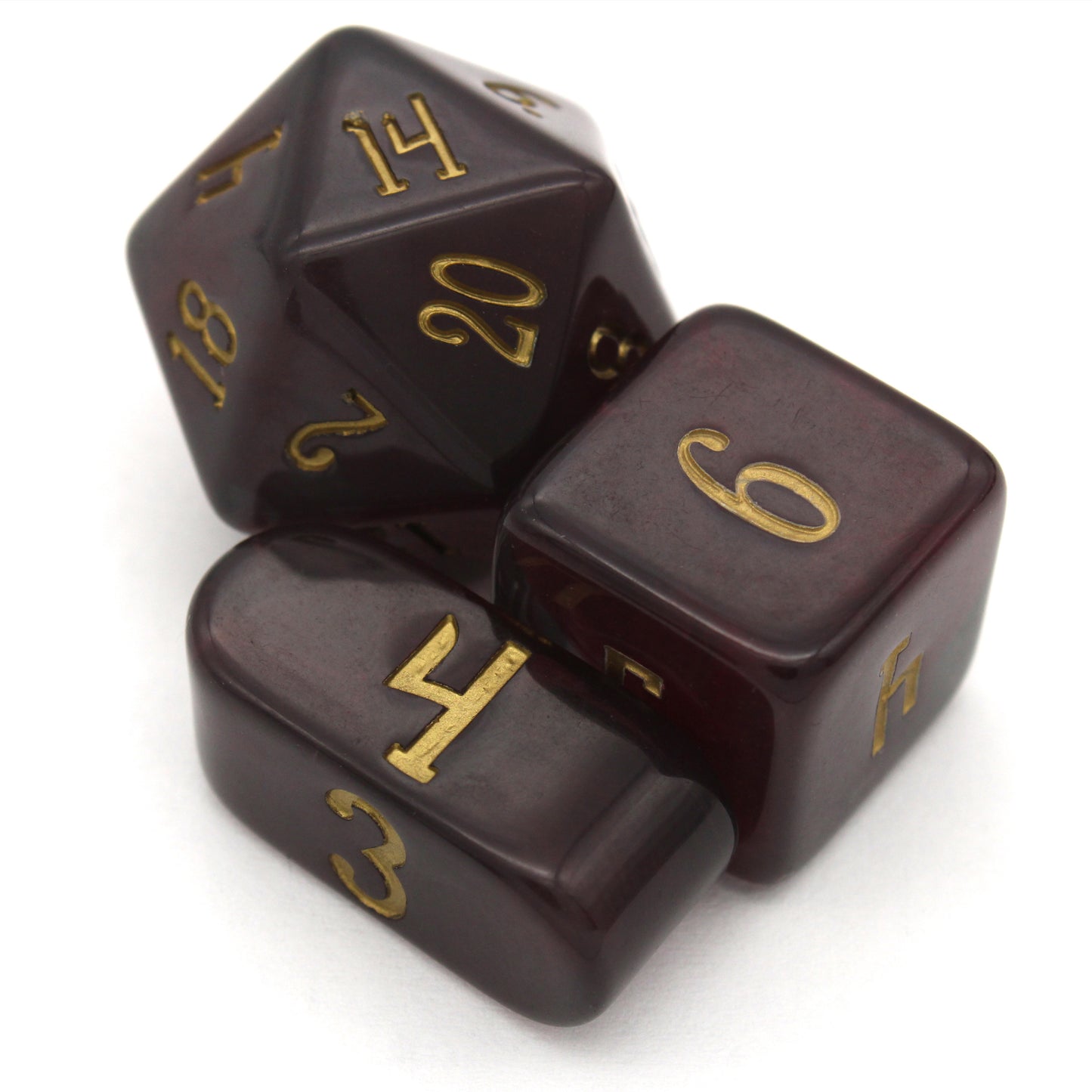 Old Blood is a 10-piece set of black and burgundy-swirled acrylic dice, inked in aged gold.