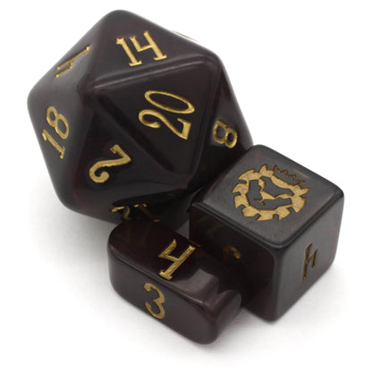 Old Blood is a 10-piece set of black and burgundy-swirled acrylic dice, inked in aged gold.