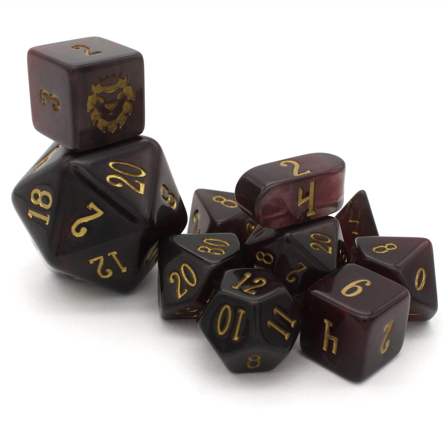 Old Blood is a 10-piece set of black and burgundy-swirled acrylic dice, inked in aged gold.