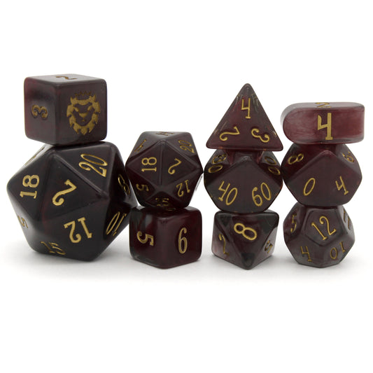 Old Blood is a 10-piece set of black and burgundy-swirled acrylic dice, inked in aged gold.