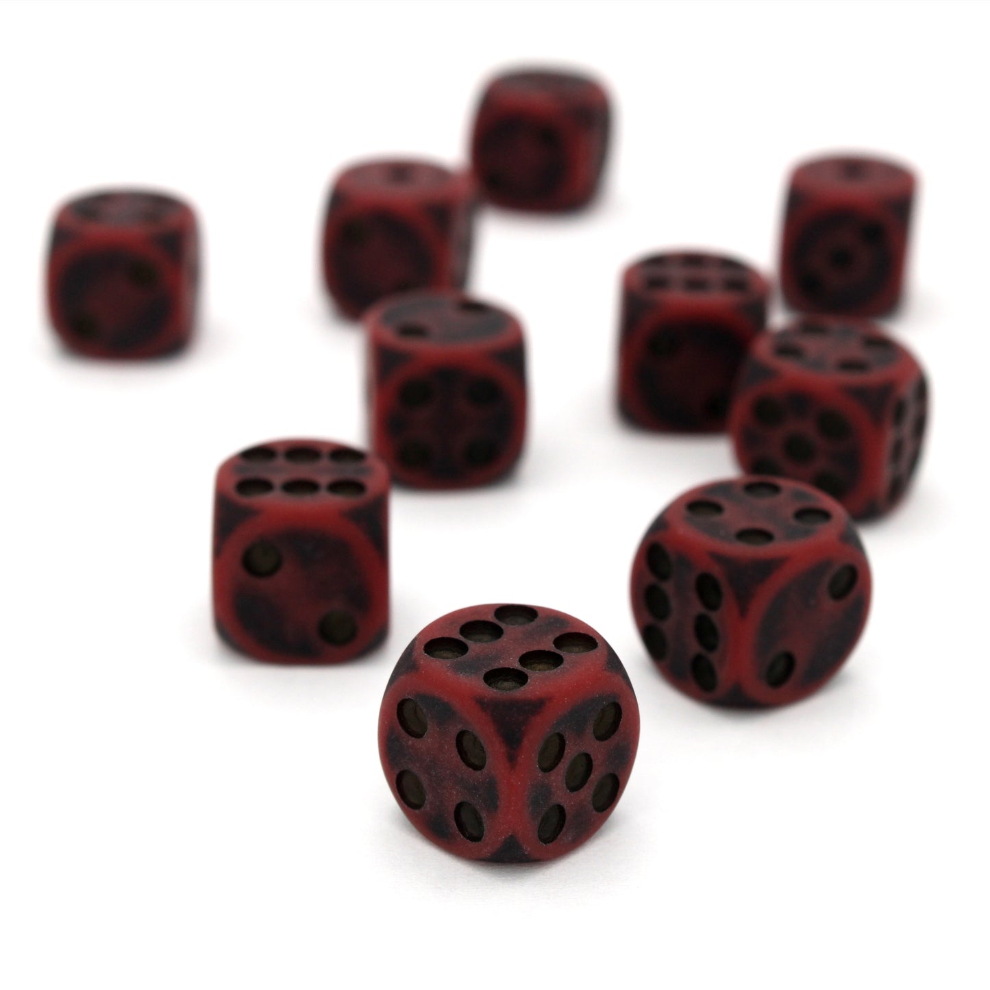Orc Blood is a 10-piece set of dark red 12mm d6s, with pips inked in black.