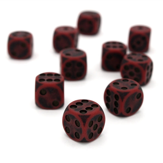 Orc Blood is a 10-piece set of dark red 12mm d6s, with pips inked in black.