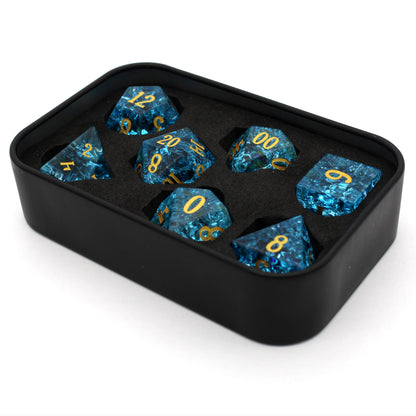 Pool Party is a 7-piece set of teal blue glass dice with a crackle effect and gold inked numbers.