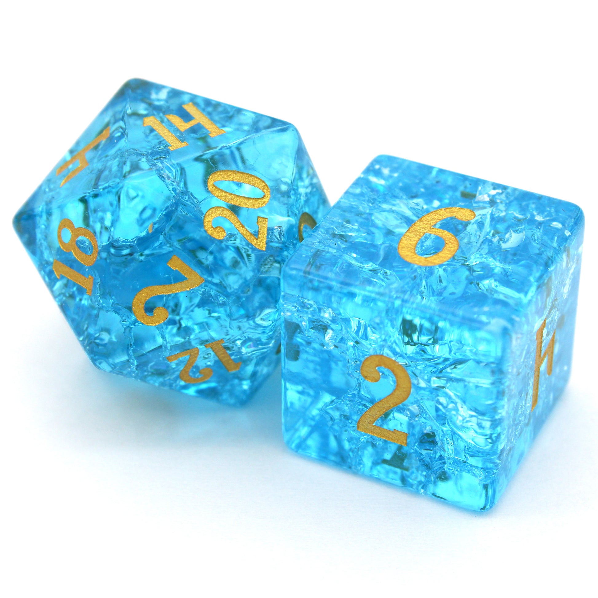Pool Party is a 7-piece set of teal blue glass dice with a crackle effect and gold inked numbers.