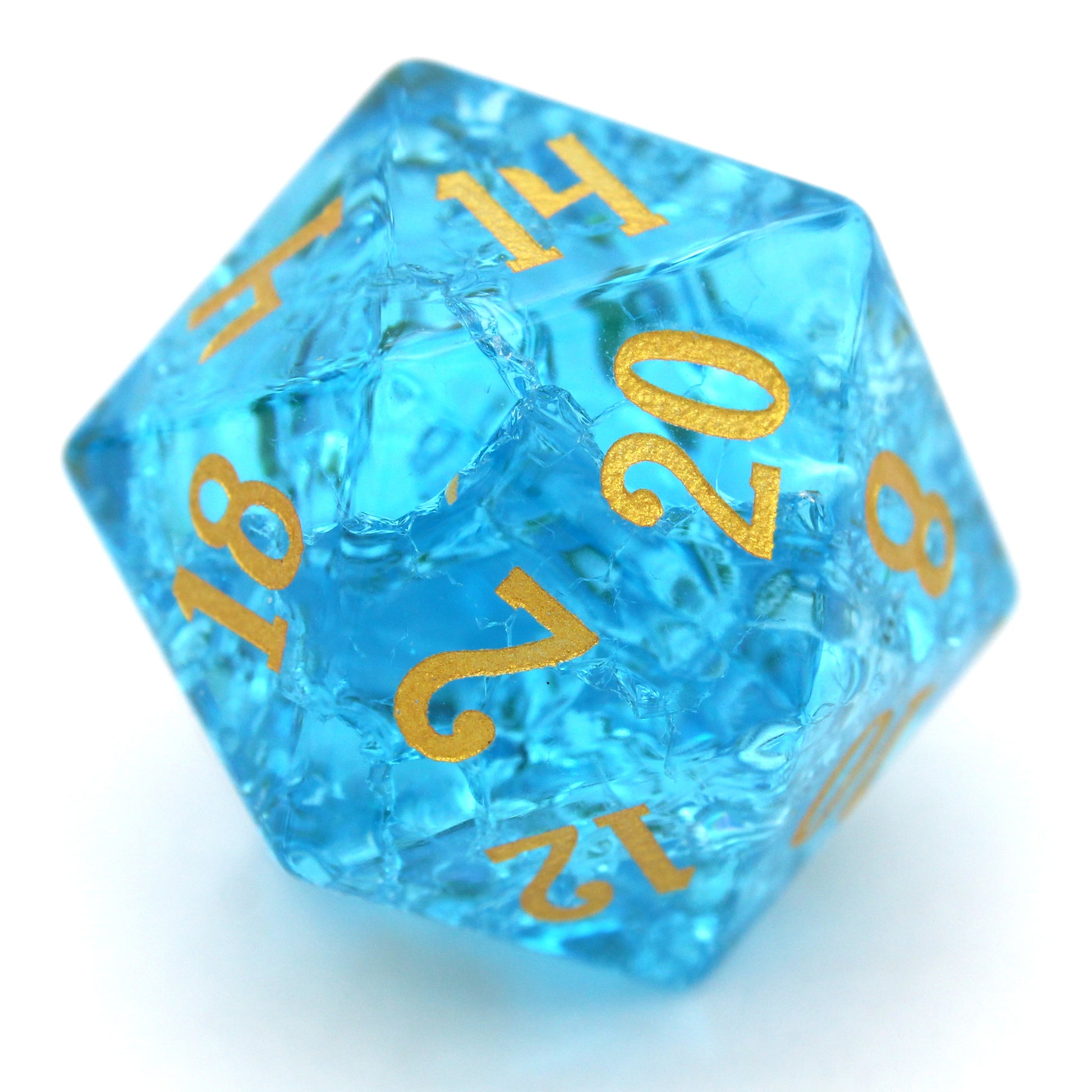 Pool Party is a 7-piece set of teal blue glass dice with a crackle effect and gold inked numbers.