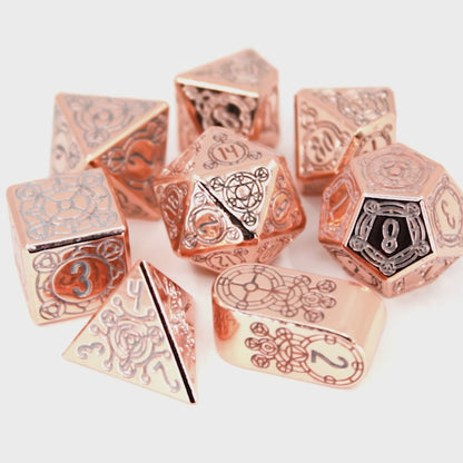Sunlight Sigil is a Dice Envy Original 8-piece set of highly polished, rose gold metal dice in our Sigil mold, inked in silver.