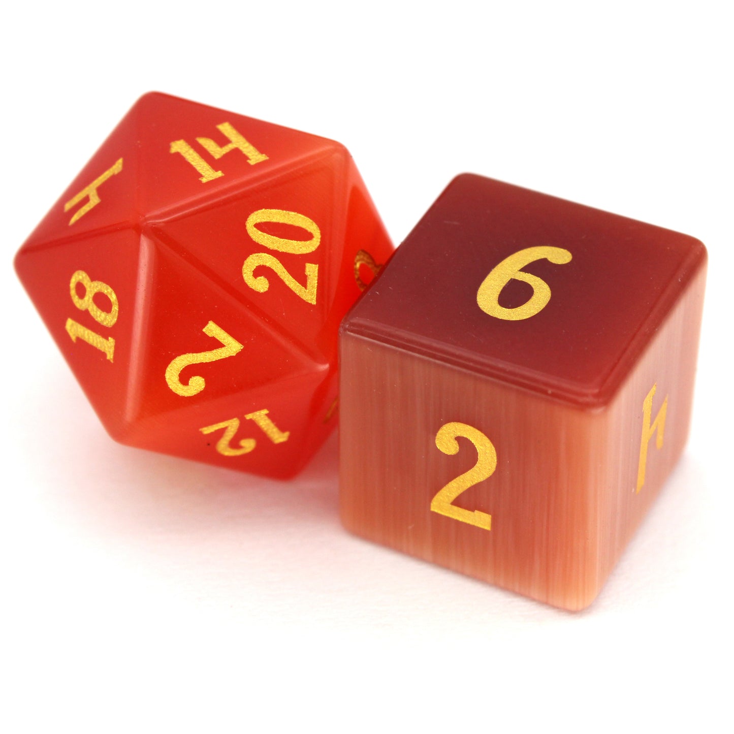 Pyromancer is a 7-piece set of orange cat's eye glass dice with gold numbering.