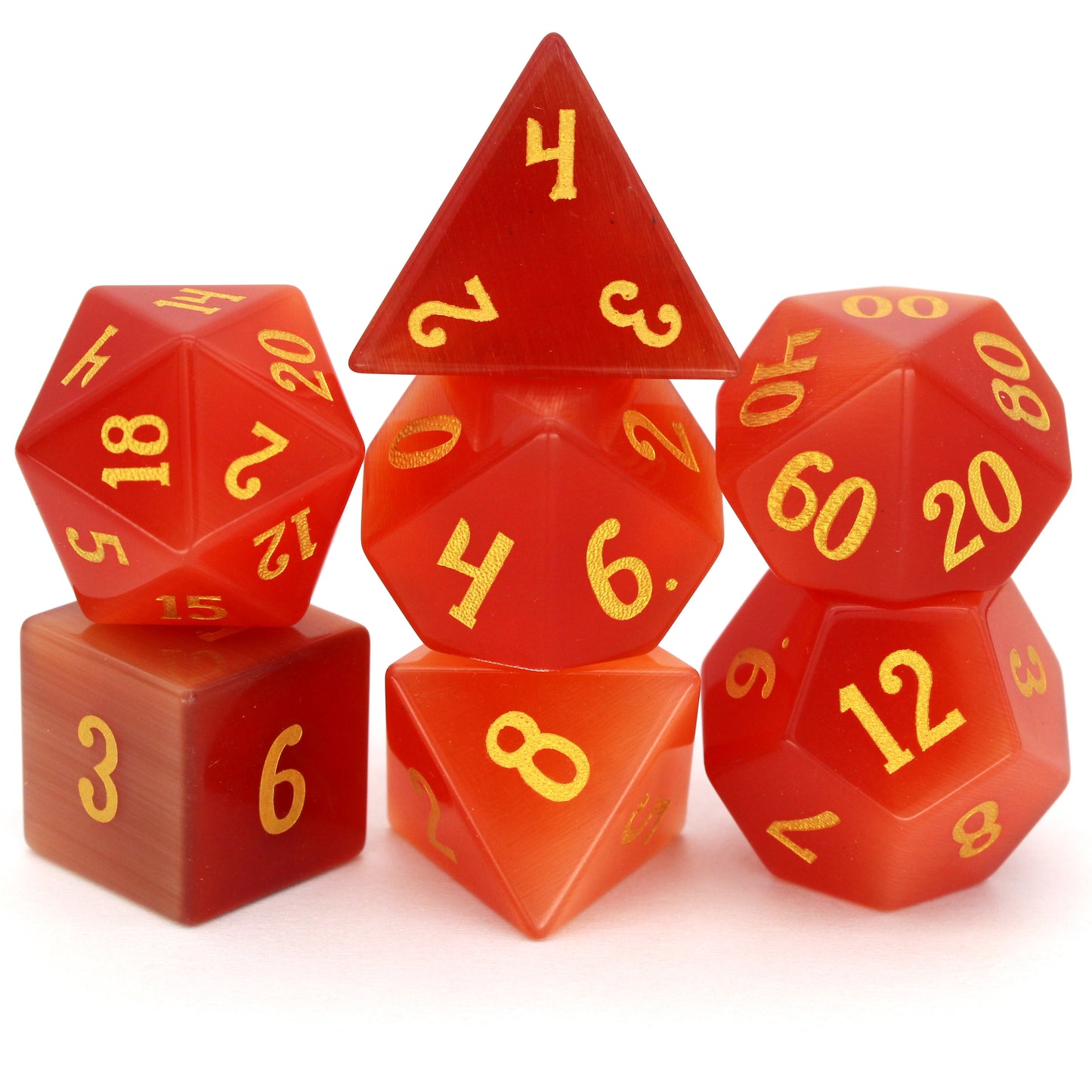 Pyromancer is a 7-piece set of orange cat's eye glass dice with gold numbering.