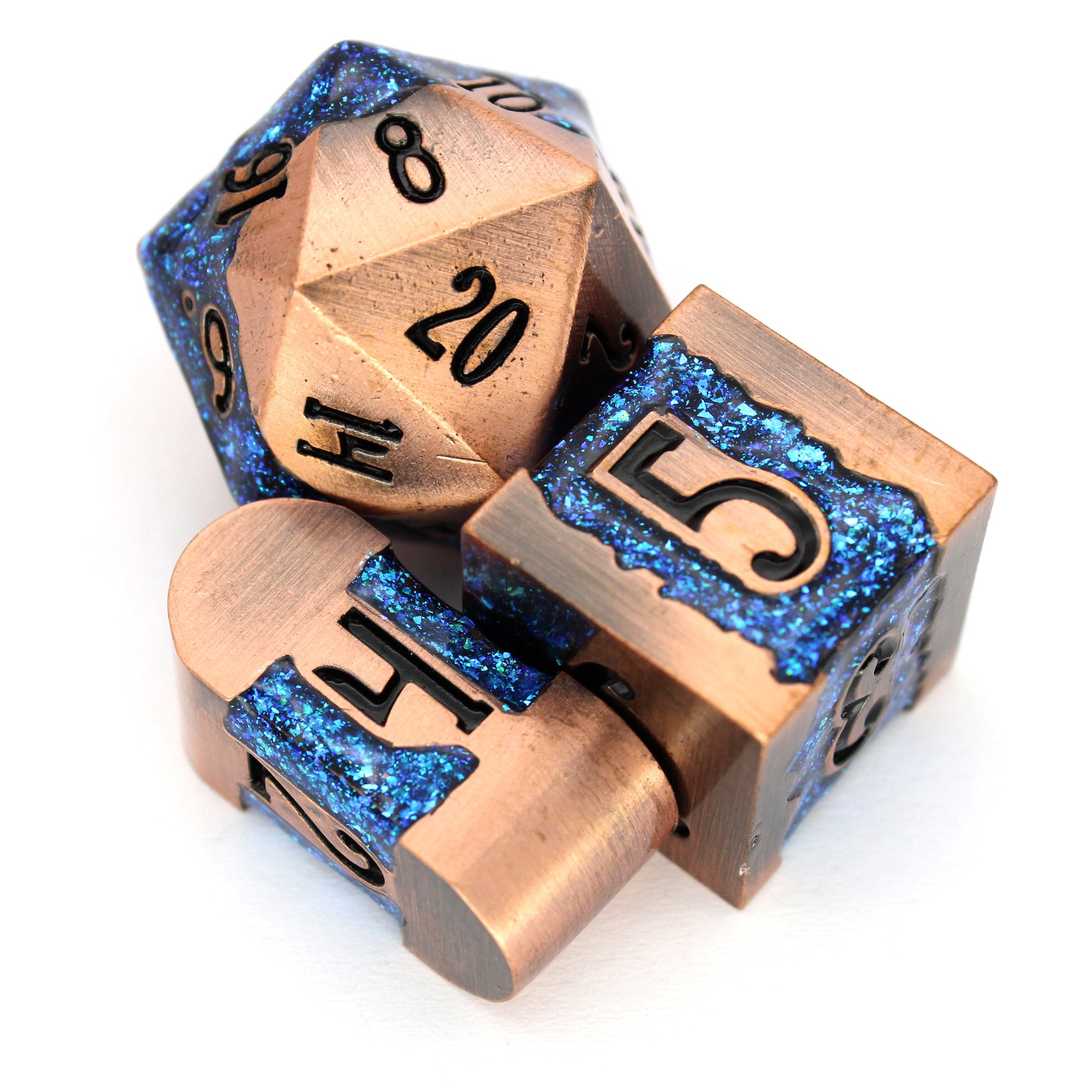 Rolling River is an 8-piece metal dice set with a rich copper frame and brilliantly glittering teal-blue enamel.