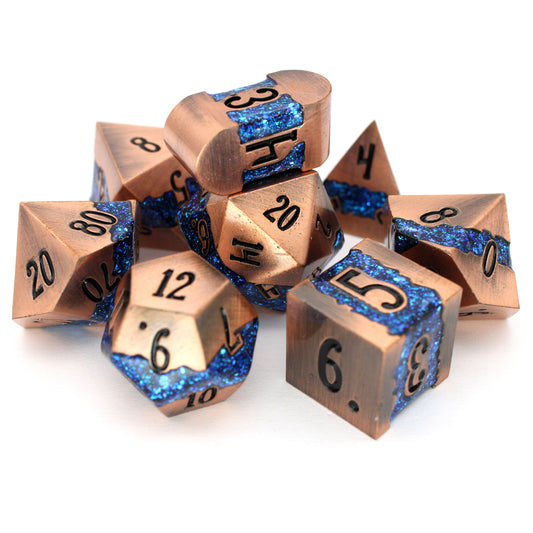 Rolling River is an 8-piece metal dice set with a rich copper frame and brilliantly glittering teal-blue enamel.