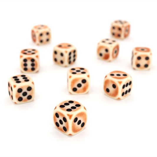 Rust Antennae is a 10-piece set of matte pale-colored 12mm d6s, with a rust patina, and pips inked in black.