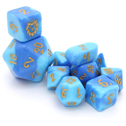 Shape Water is a 10-piece acrylic dice set with swirled shades of blue, inked in beach sand yellow.