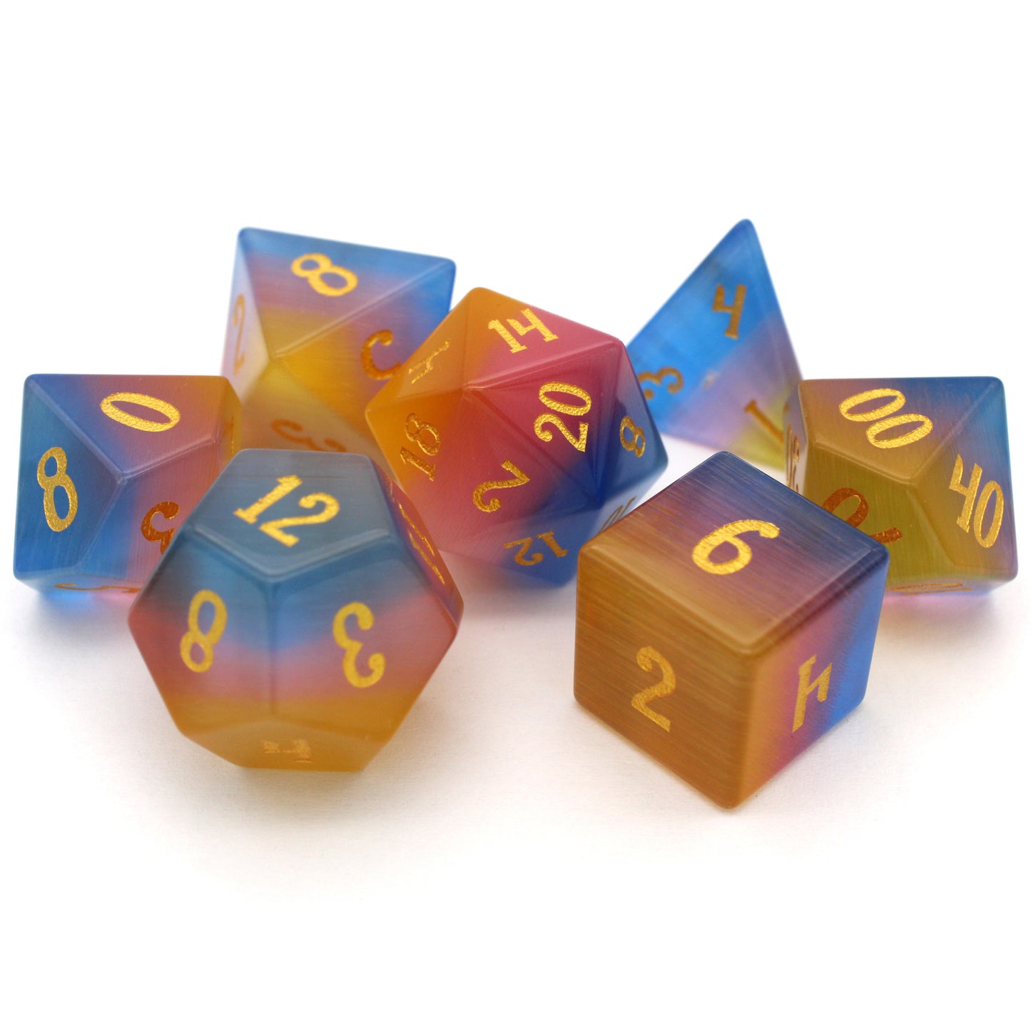 Sparkle Horse is a 7-piece set of blue, yellow, and pink glass dice with gold inked numbering.