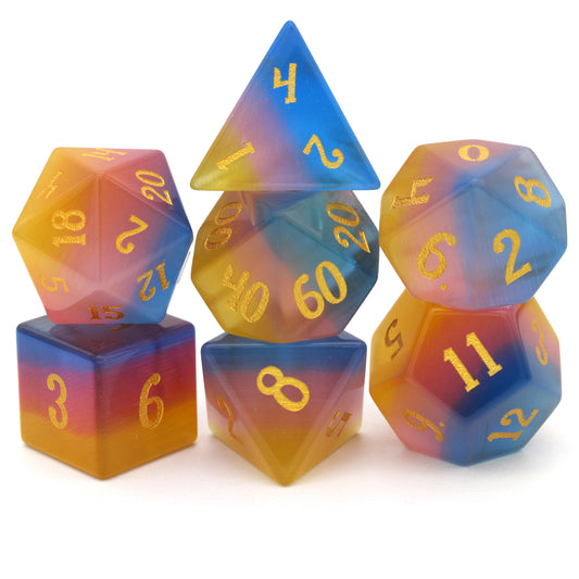 Sparkle Horse is a 7-piece set of blue, yellow, and pink glass dice with gold inked numbering.
