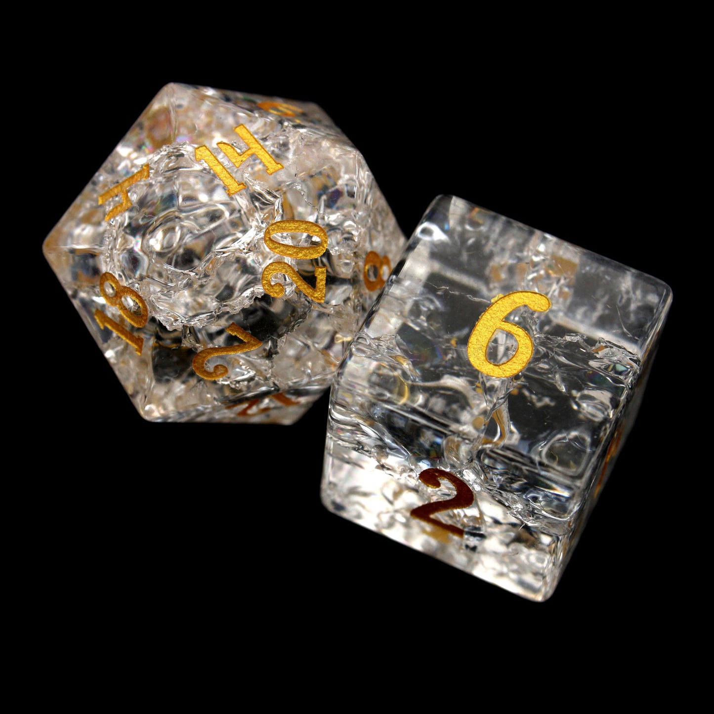 Stardust is a 7-piece set of clear crystal dice with a crackle effect and gold inked numbers.