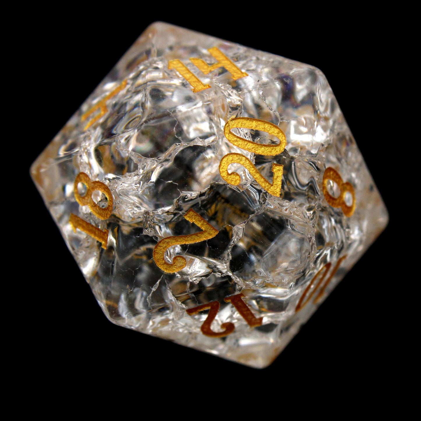 Stardust is a 7-piece set of clear crystal dice with a crackle effect and gold inked numbers.