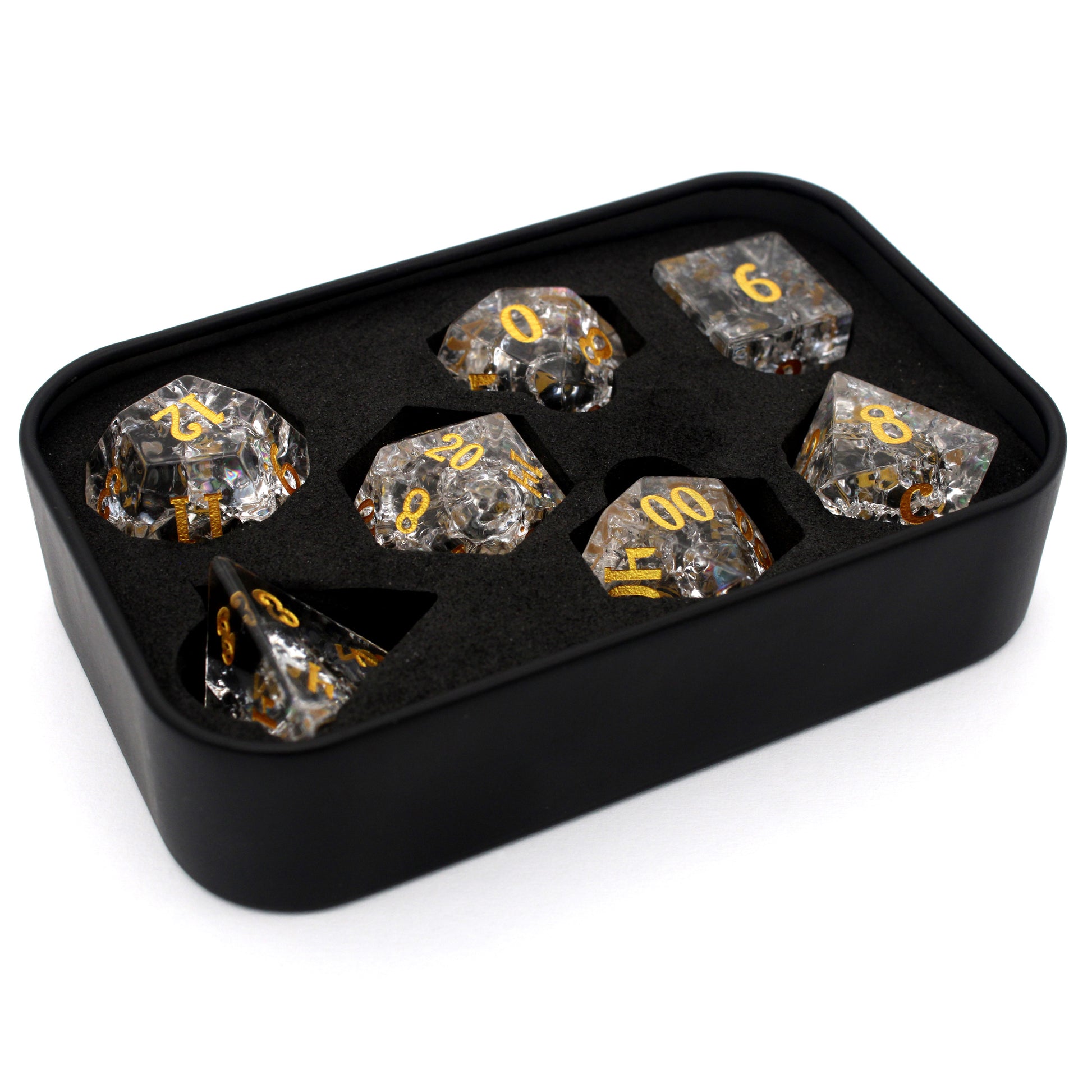 Stardust is a 7-piece set of clear crystal dice with a crackle effect and gold inked numbers.