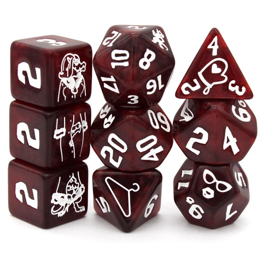 Three Kobolds is a 9-piece swirled&nbsp;red resin set engraved with articles of clothing inked in bright white. Included are 3 d6 that form a totally normal dragonborn in a wig and winter coat.