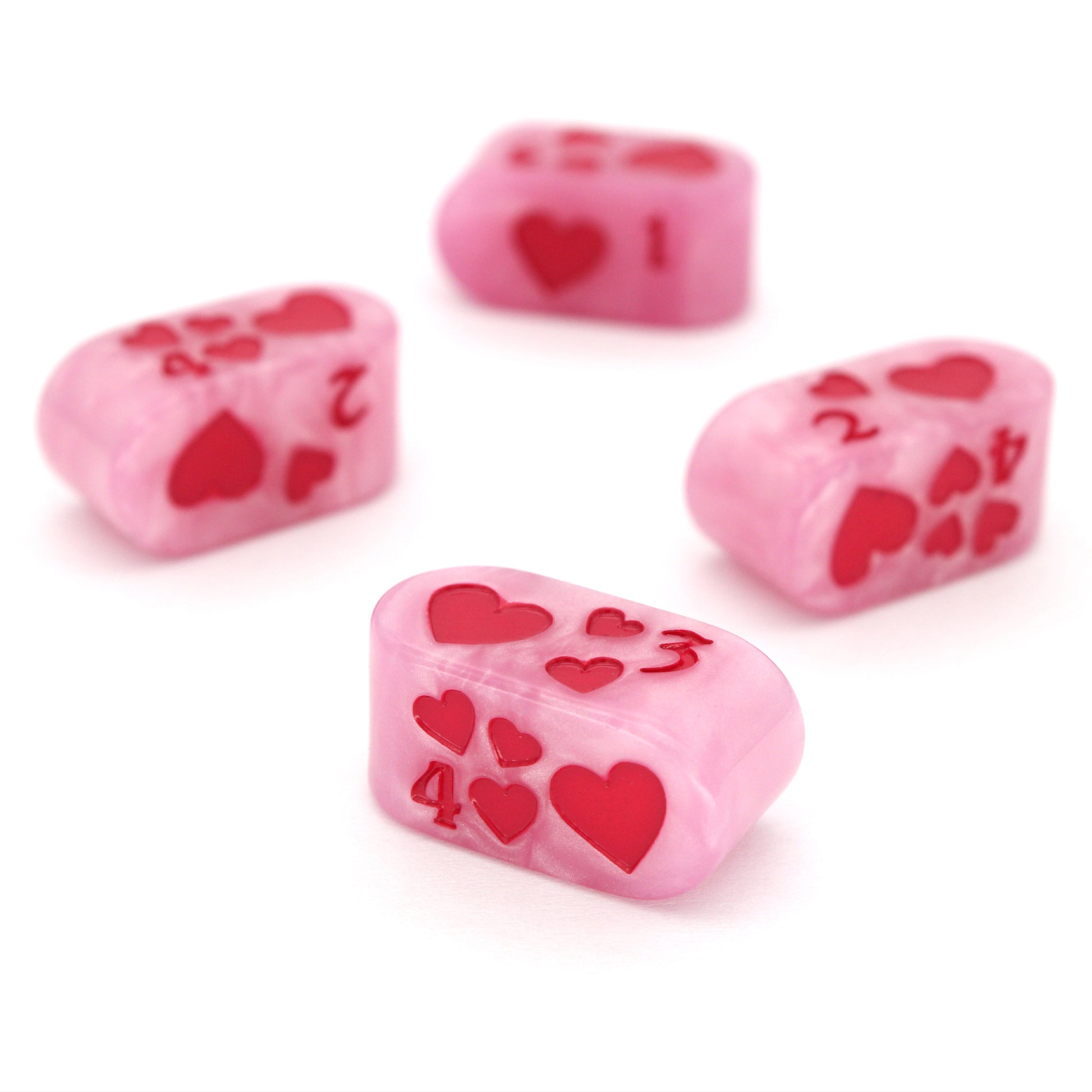 Toon Hearts - Tyranny are pearly pink Dice Envy Original Infinity d4s inked in demonic fuchsia. Each one measures 12mm x 24mm.