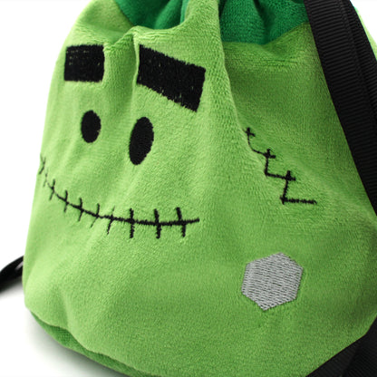 Each Trick or Treat Mystery Bag contains a selection of spooky delights, including 3 full sets of dice, as well as an assortment of goodies, all held in a plush Franken-pouch.